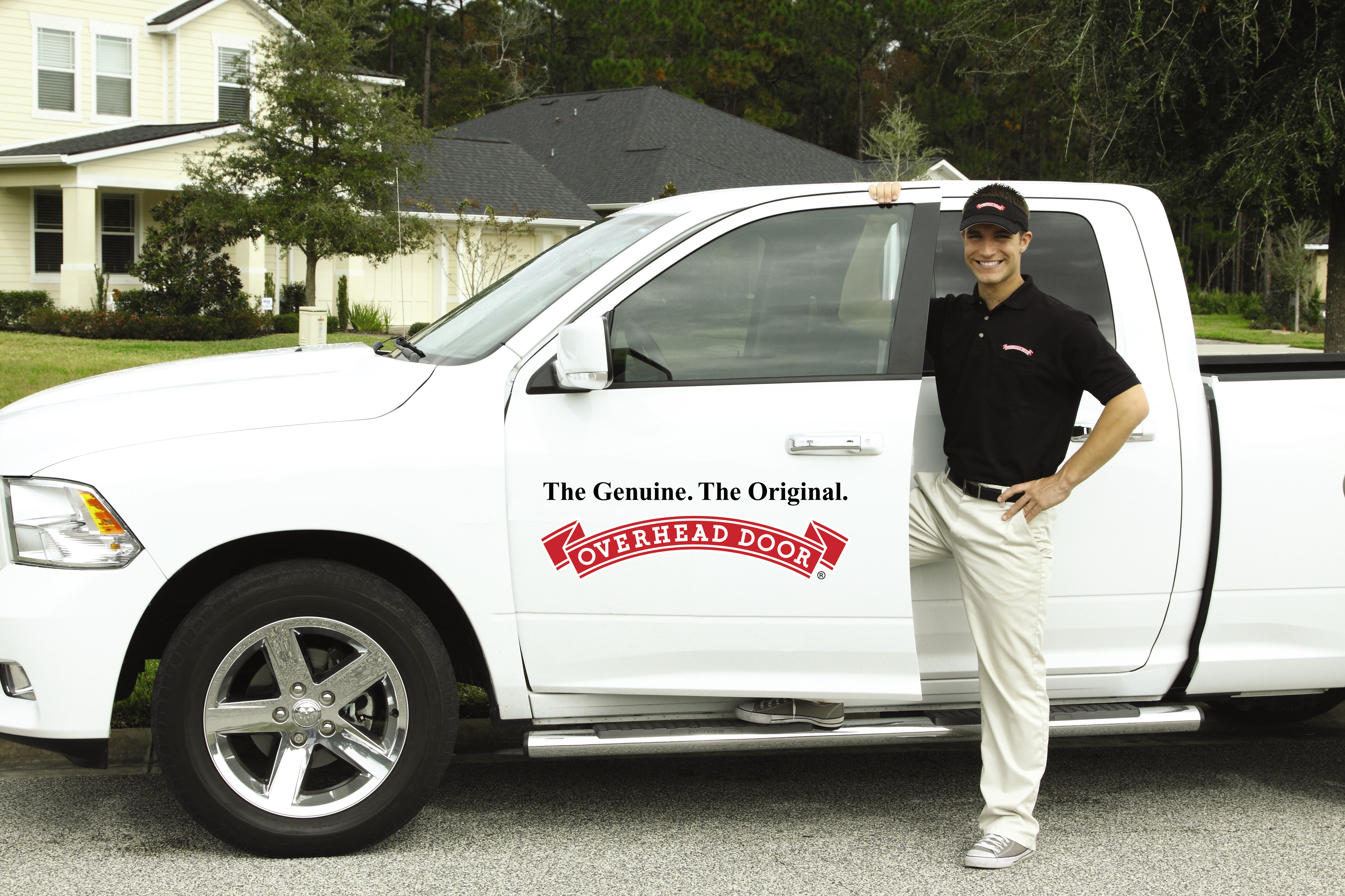 A Man Standing Beside a Service Truck | Commercial Garage Doors Cincinnati