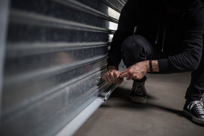 a man trying to open the garage