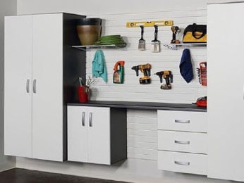 Easy access to your belongings in a neatly organized garage – utilize garage storage cabinets and a hook-based wall storage system.