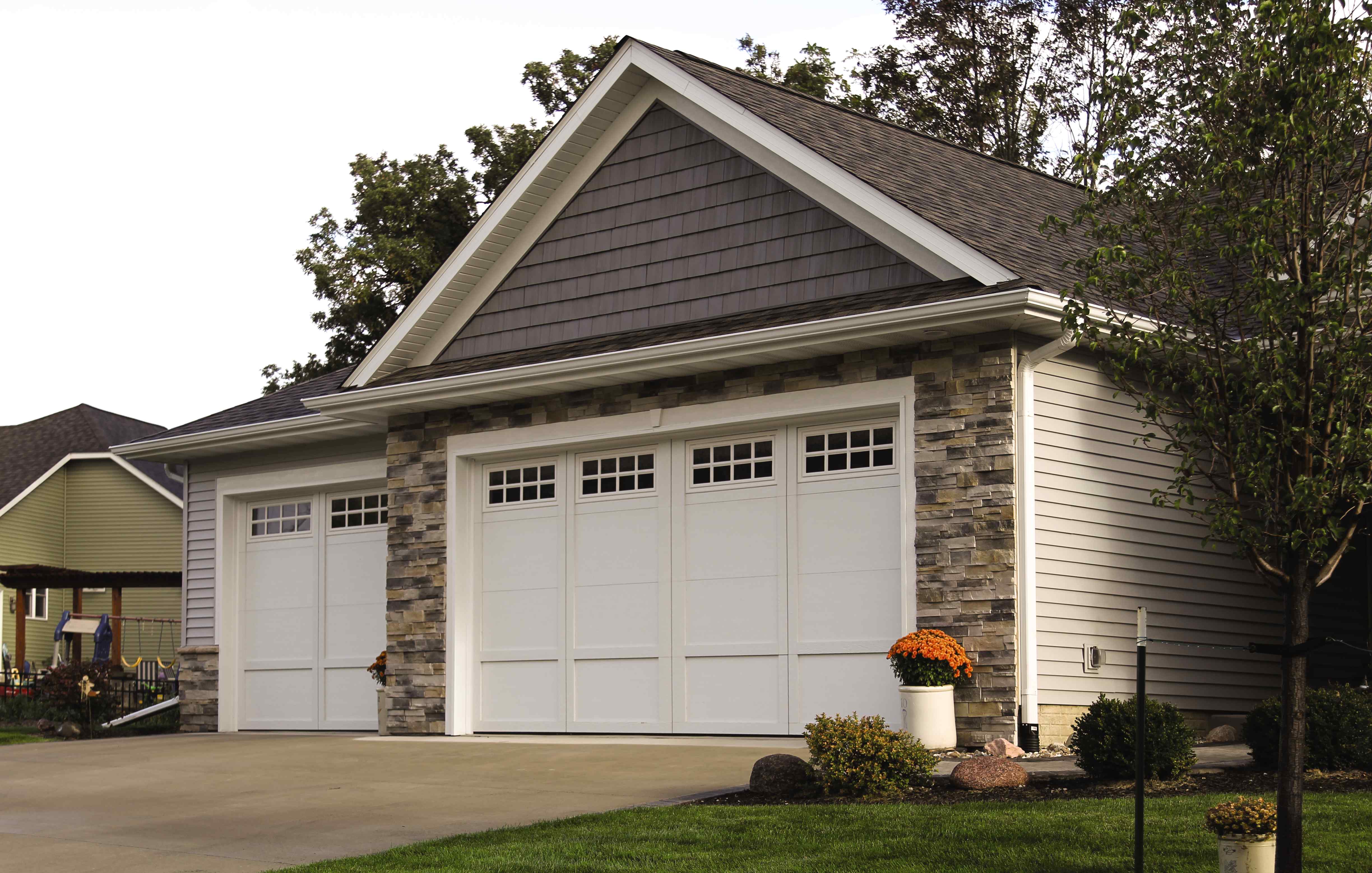 When should I have my garage door opener repaired vs replaced?